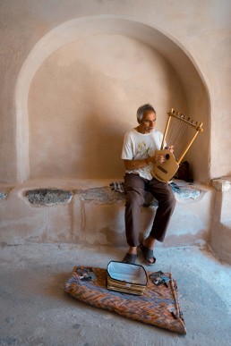 Man playing music in Santorini streets